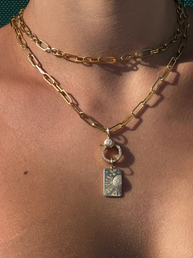 14K Gold Diamond Sun Dog Tag
Diamond Sun Pendant
Gold Dog Tag Necklace with Sun Design
14K Gold Sun Charm with Diamonds
Diamond Sunburst Dog Tag Pendant
Sun dog tag
Diamond sun charm
Gold sunburst pendant
Luxury sun jewelry
Diamond necklace
Minimalist dog tag
Sun-inspired charm
Fine gold pendant
Gold diamond necklace
