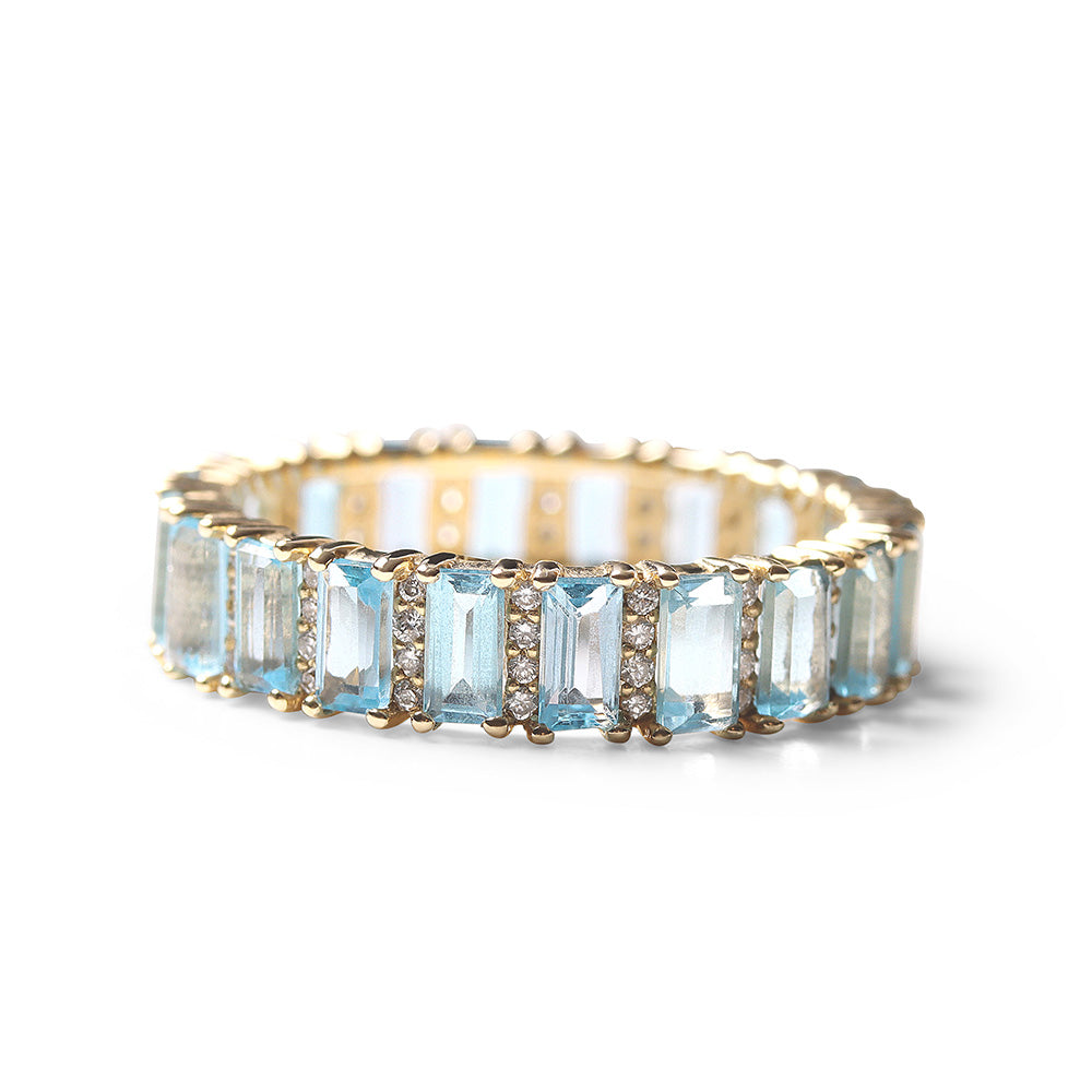 BLUE TOPAZ AND DIAMOND BAGUETTE CUT ETERNITY BAND