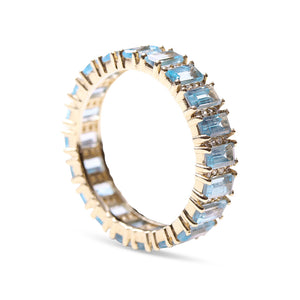 BLUE TOPAZ AND DIAMOND BAGUETTE CUT ETERNITY RING