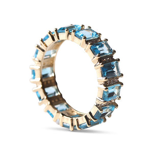 BLUE TOPAZ AND DIAMOND AND EMERALD CUT ETERNITY RING